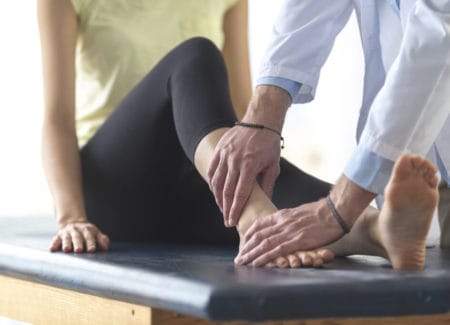 Doctor treating patient with Ankle Pain Without Injury